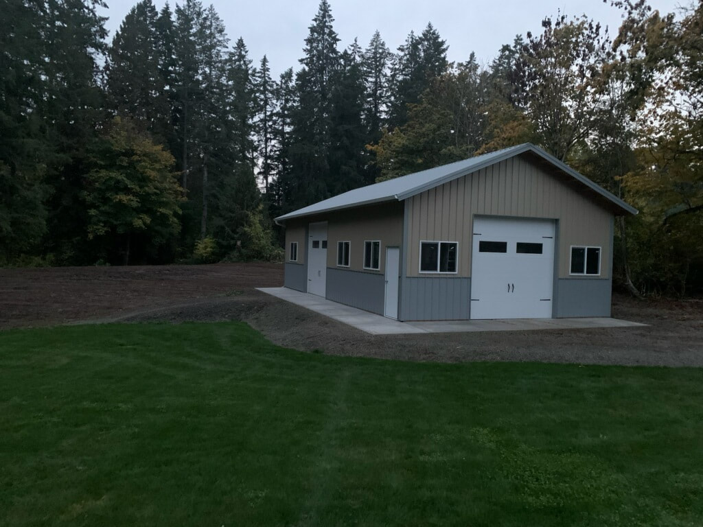 Picture of a gray garage/workshop made using pole building construction.